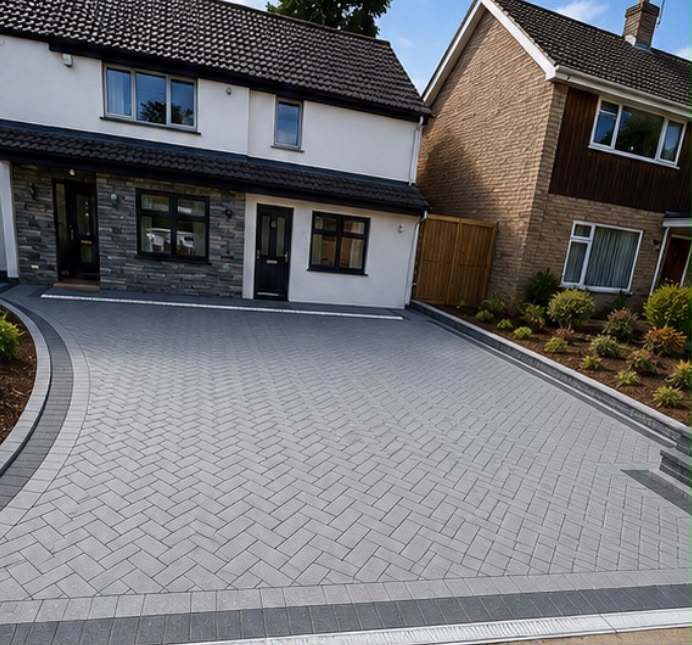 Block paving driveway with herringbone pattern