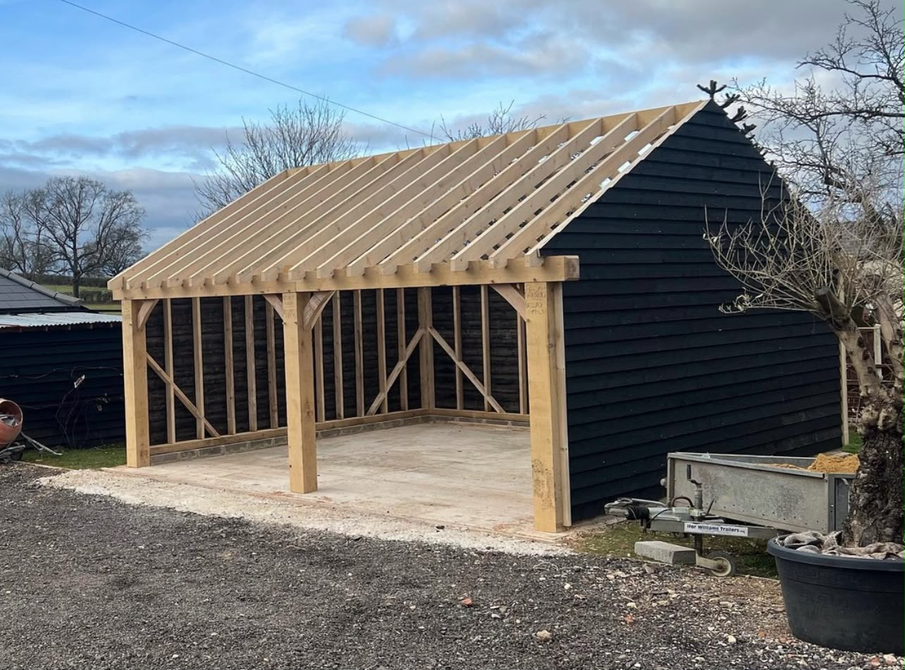 Oak-framed garden garage with pitched timber roof structure