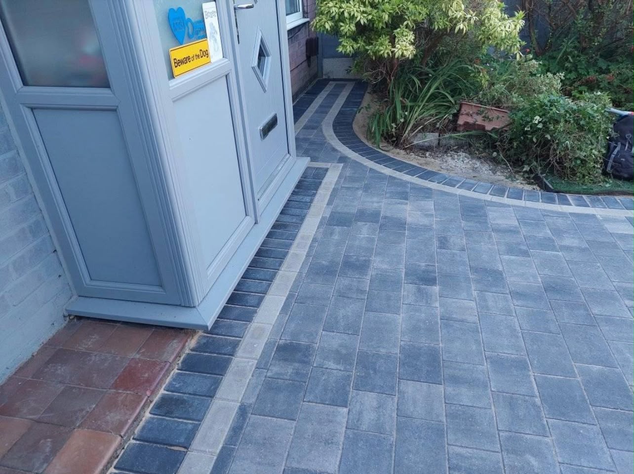 Completed block paving front path with charcoal border and stone edge