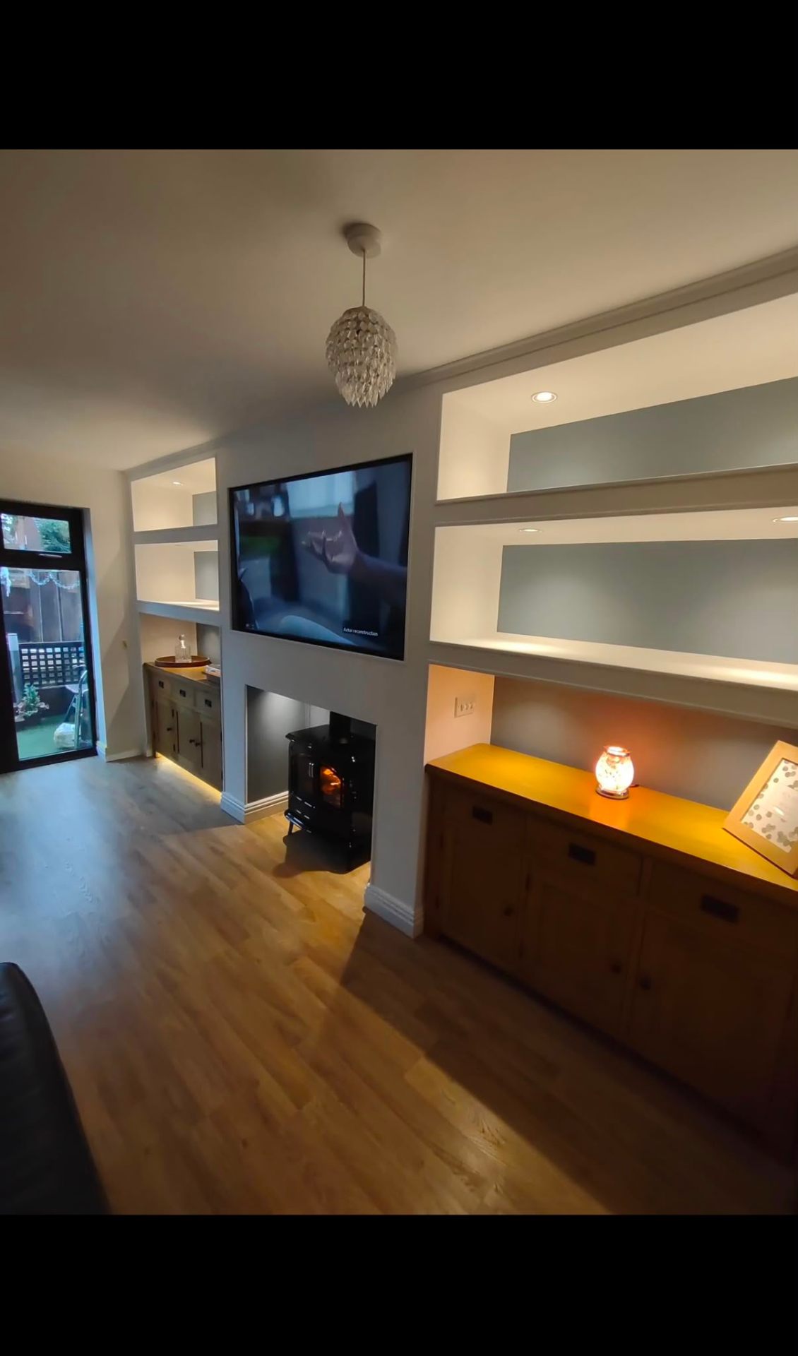 Chimney breast with log burner and floating alcove shelves