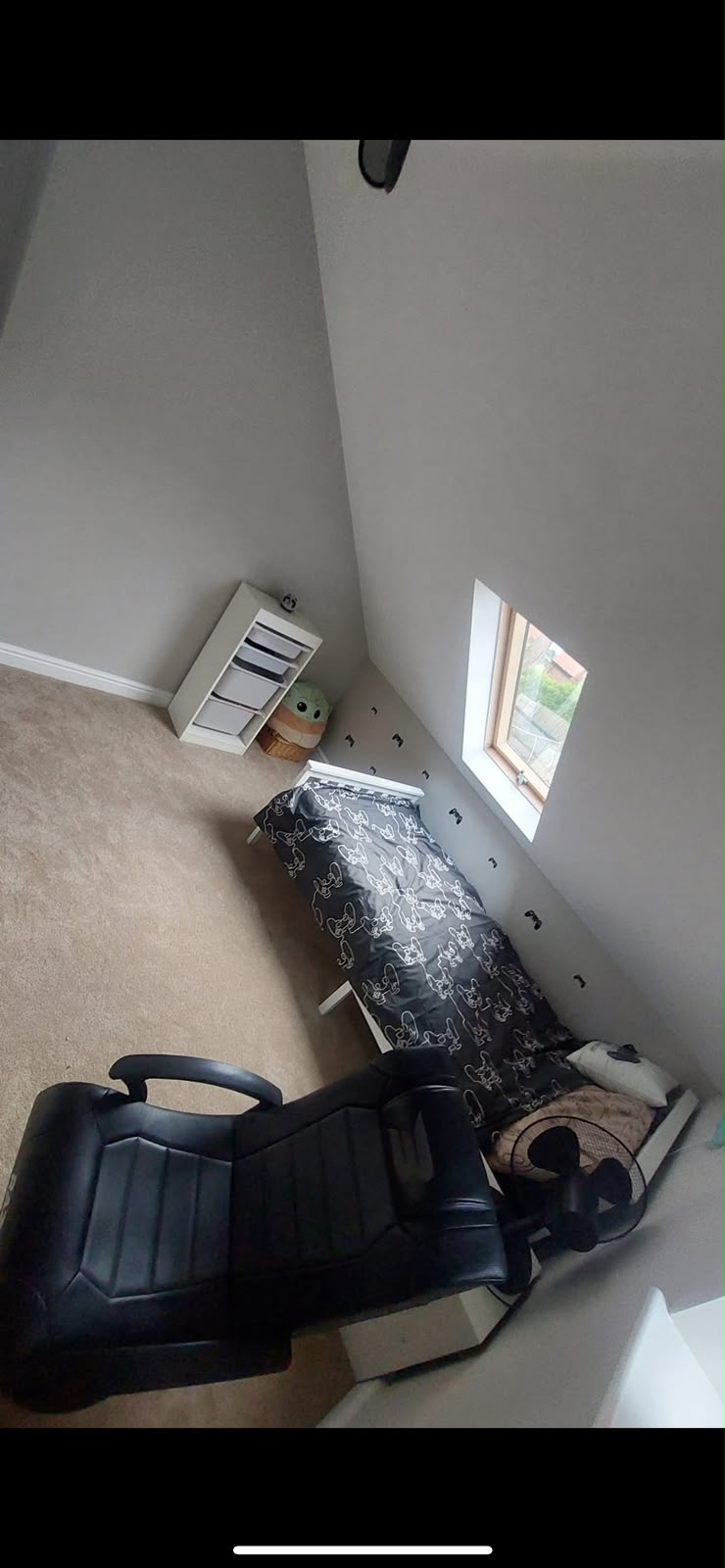 Completed loft bedroom with carpet and Velux window