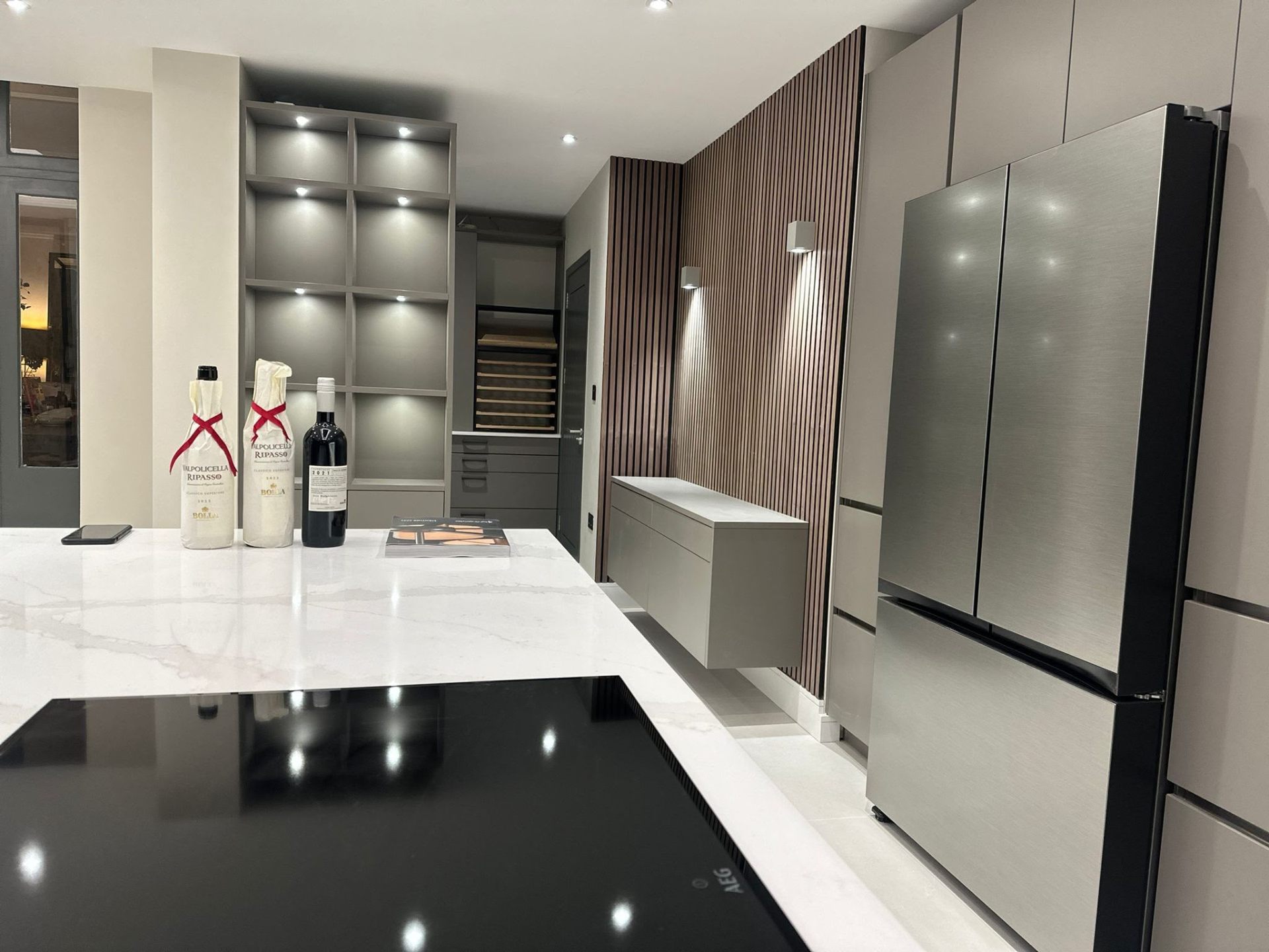 Luxury kitchen island in marble with integrated appliances