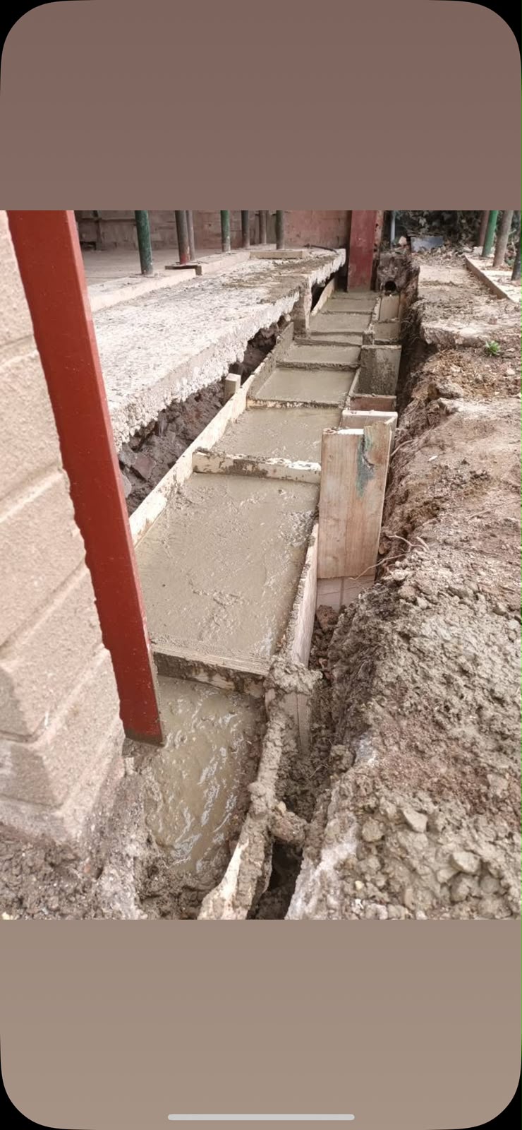 Concrete strip foundations poured for extension