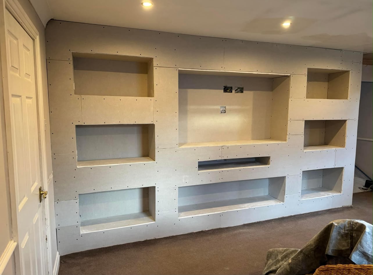 Media wall plasterboard stage with alcoves formed