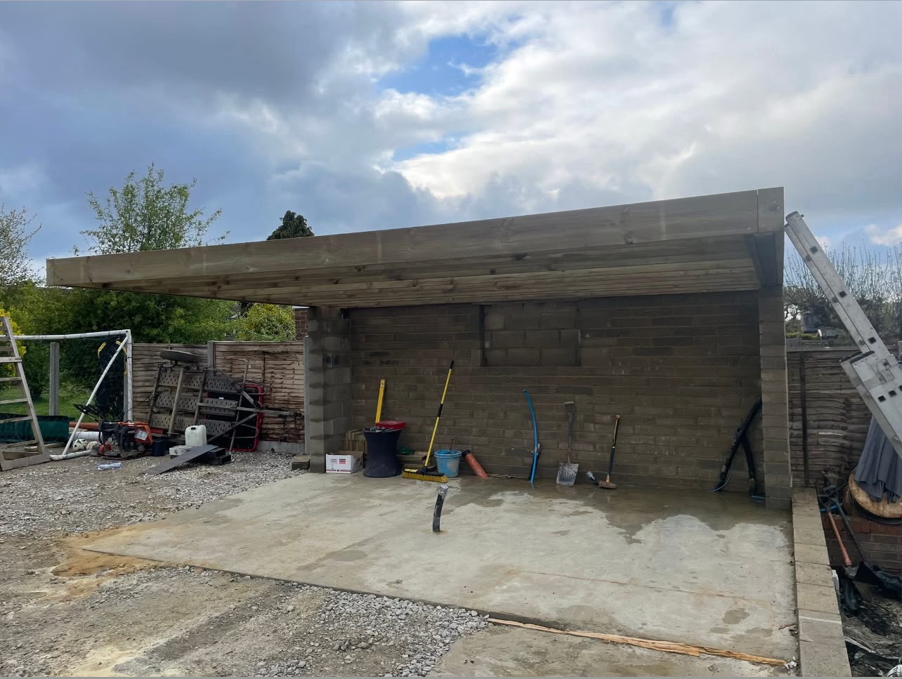 Timber-framed garden room roof under construction